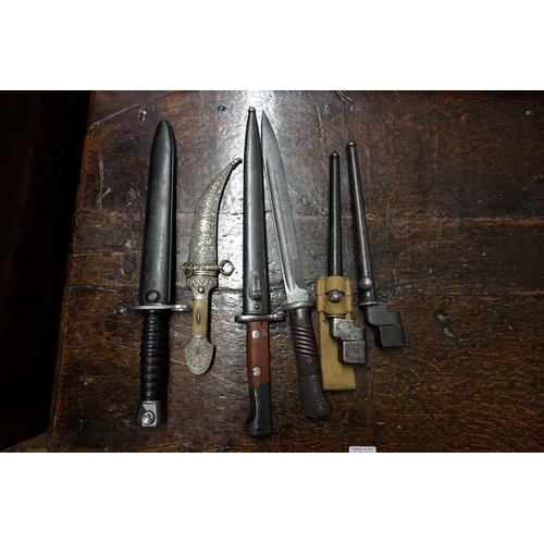 1841 - A mixed group of militaria, to include a Swiss bayonet and plastic sheath; two spike bayonets and sh... 