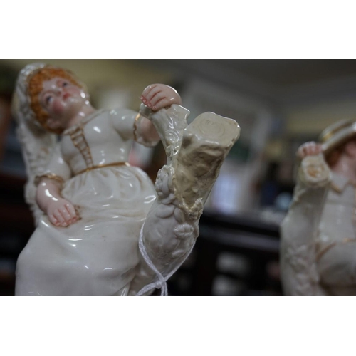 1843 - A pair of Victorian Royal Worcester figures, by James Hadley, 19cm high, (restoration to each).... 