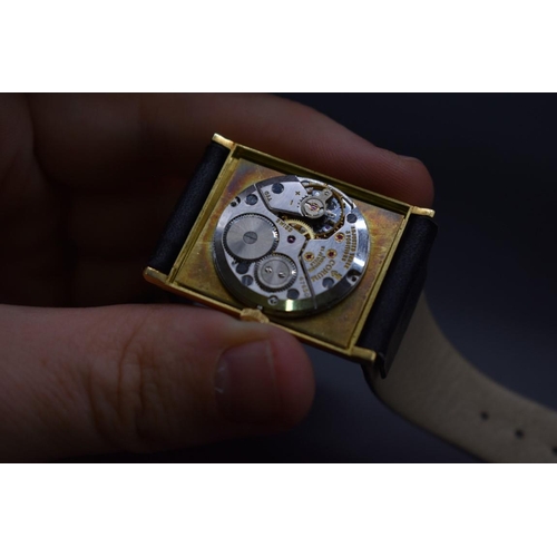 19 - A Van Cleef & Arpels Corum 18k gold manual wind wristwatch, 26mm, on black leather strap.... 