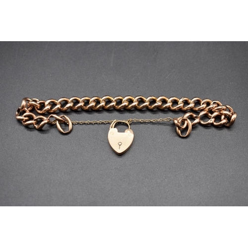 195 - A rose gold hollow link bracelet, stamped 15, with attached 15ct gold padlock clasp, 20cm, 22g.... 