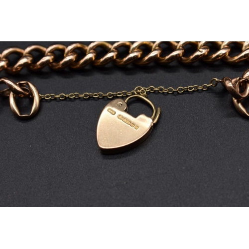 195 - A rose gold hollow link bracelet, stamped 15, with attached 15ct gold padlock clasp, 20cm, 22g.... 