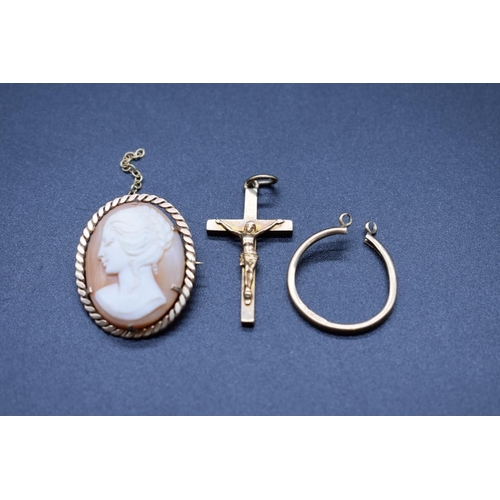 201 - A 9ct gold framed carved shell cameo brooch, 3cm; together with a 9ct gold crucifix, 3.4cm, 3g; and ... 