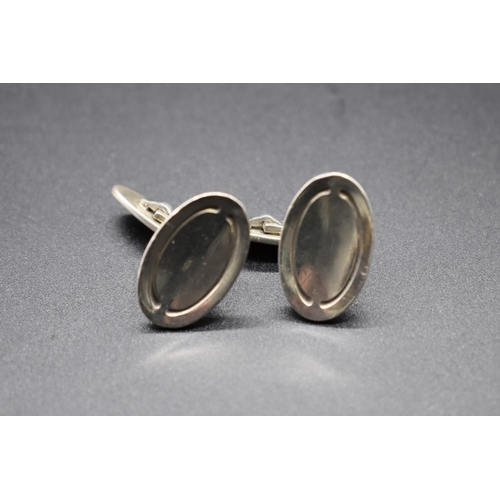 204 - A pair of Georg Jensen sterling silver oval cufflinks, no. 75a, 14g.