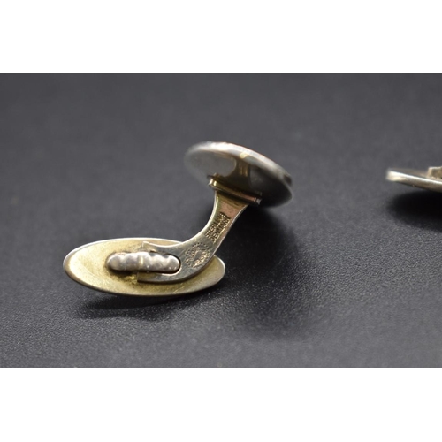 204 - A pair of Georg Jensen sterling silver oval cufflinks, no. 75a, 14g.