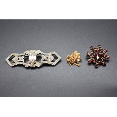 207 - An Art Deco paste brooch, 70mm; together with a Victorian garnet set floral brooch, 30mm; and a plat... 