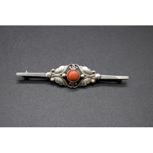 210 - A Georg Jensen sterling silver bar brooch, set cabochon coral to centre, No 224b, 61.5mm.... 