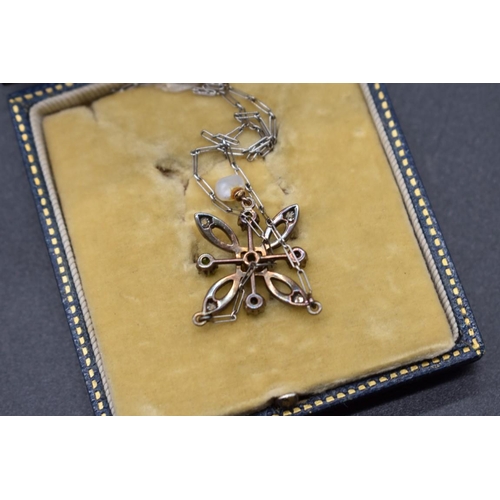 213 - An Edwardian diamond and peridot pendant with pearl drop, 27mm, in a D & J Wellby fitted case.... 