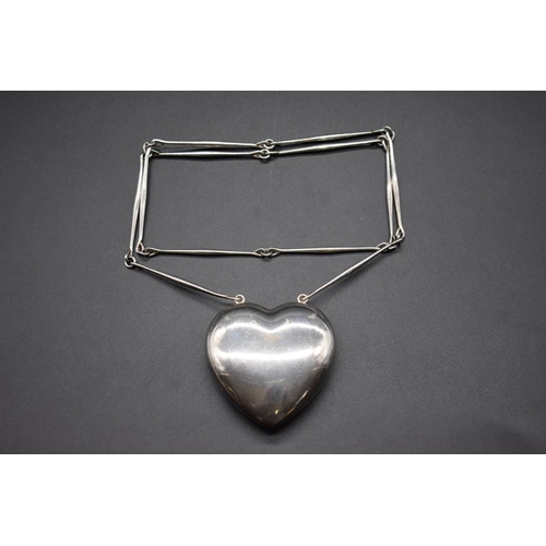 215 - A Georg Jensen large 'Puffy Heart' pendant, on chain, No. 126, designed by Astrid Fog, 101g.... 