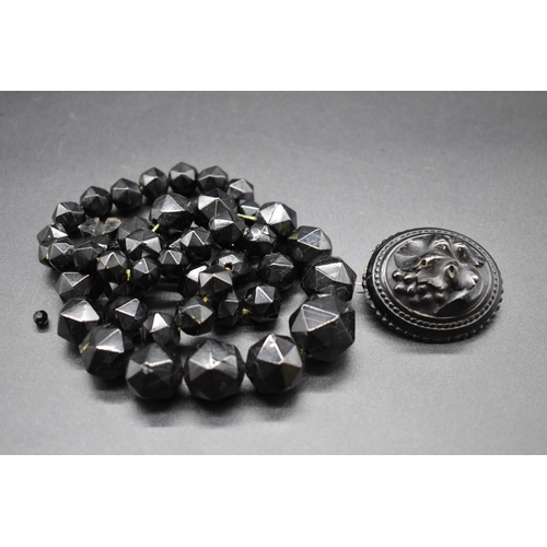 224 - A Victorian Whitby jet graduated and faceted bead necklace, 60cm; together with Victorian Whitby jet... 