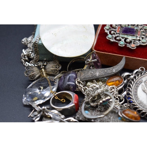 229 - A group of silver and white metal jewellery.