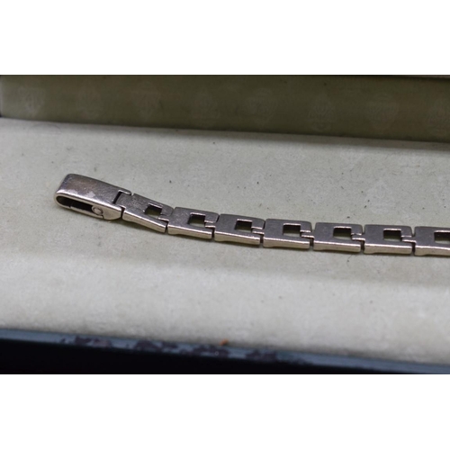 241 - A cased Gucci silver link bracelet, stamped 925, 18.5cm, 24g.