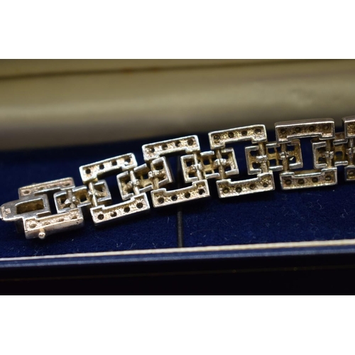 242 - An Art Deco style silver and paste bracelet, 18cm, 39g gross weight.