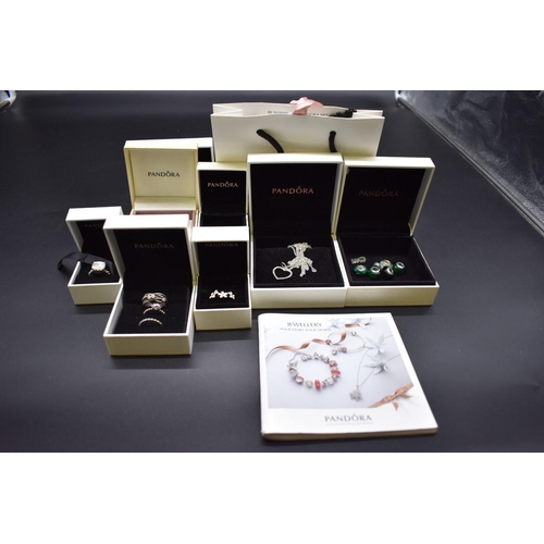 251 - A quantity of Pandora 925 silver jewellery; comprising rings, a necklace, charms and jewellery boxes... 