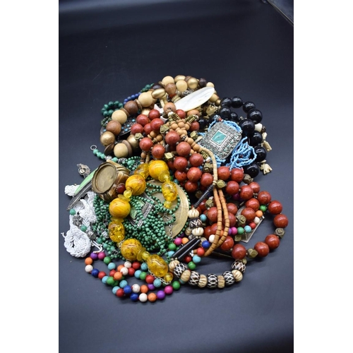 255 - An interesting collection of costume jewellery; to include a malachite bead necklace.... 