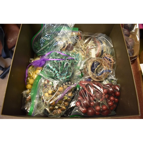 255a - A large quantity of costume jewellery, to include bead necklaces, bracelets and brooches.... 