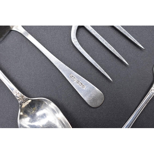 498X - A quantity of silver cutlery; to include a pair of Georgian bright cut mustard spoons and a Victoria... 