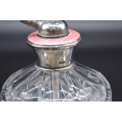 499F - An EPNS toast rack, stamped Asprey London, 8.8cm; together with a silver mounted cut glass atomizer;... 