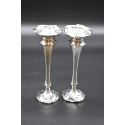 499I - A pair of silver trumpet vases, weighted, 19cm high.