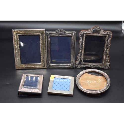 499N - Six various silver photograph frames; to include a small Links of London example.