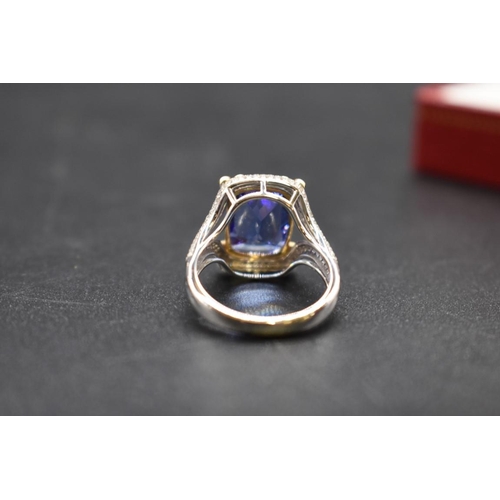 62 - A white and yellow metal cushion cut tanzanite ring, 4.7ct, set with small diamonds, stamped 14k,&nb... 