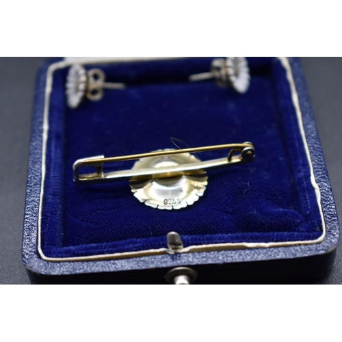 63 - A Danish sterling silver gilt and enamel daisy bar brooch and matching ear studs, by Anton Michelsen... 