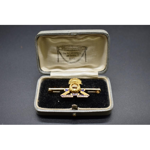 68 - A cased 15ct gold and blue enamel 'The Lancashire Fusiliers' sweetheart bar brooch, 47mm, 5.8g gross... 