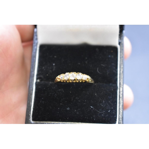 73 - An Edwardian 18ct gold diamond five stone ring, Size O, gross weight 2.2g.