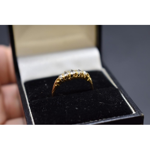 73 - An Edwardian 18ct gold diamond five stone ring, Size O, gross weight 2.2g.