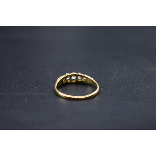 73 - An Edwardian 18ct gold diamond five stone ring, Size O, gross weight 2.2g.