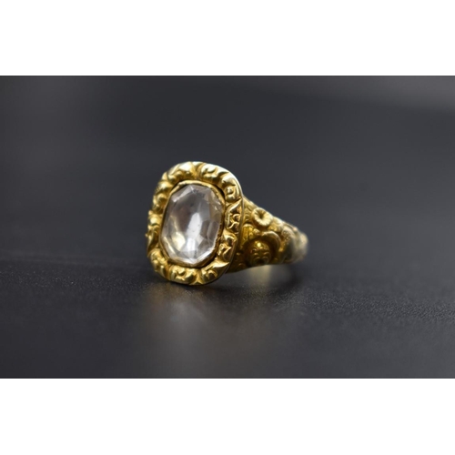 75 - An antique yellow metal ring, set faceted quartz, size Q.