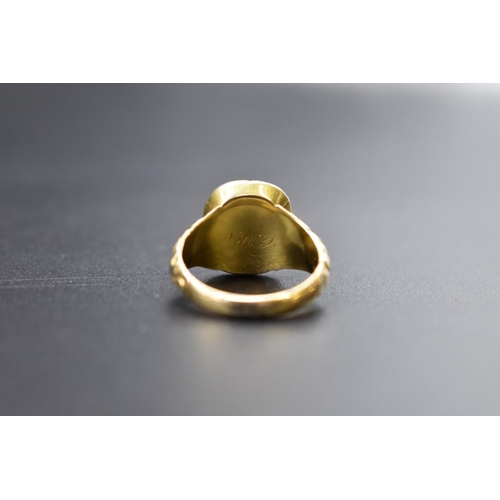 75 - An antique yellow metal ring, set faceted quartz, size Q.