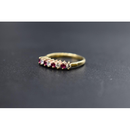 78 - A yellow metal ruby and diamond eight stone ring, stamped 14k 585, size N, 2.3g gross weight.... 