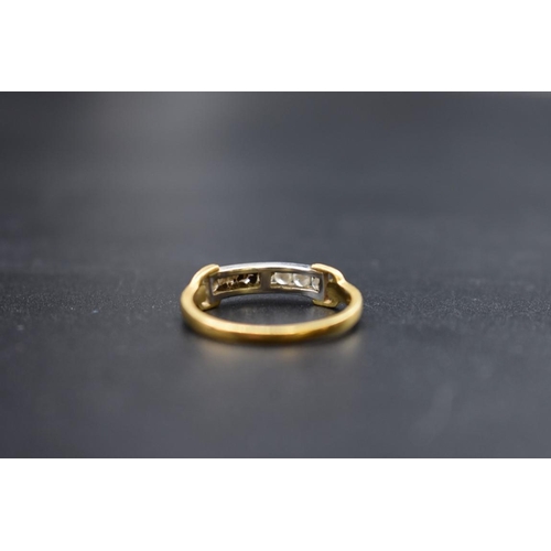 82 - An 18ct gold channel set diamond seven stone half eternity ring, size R 1/2, 3g.