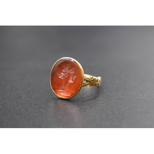 85 - An interesting antique yellow metal and carnelian intaglio ring, the intaglio possibly Roman, finely... 