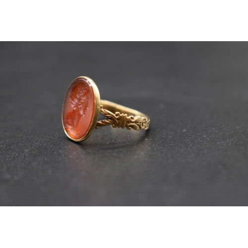 85 - An interesting antique yellow metal and carnelian intaglio ring, the intaglio possibly Roman, finely... 