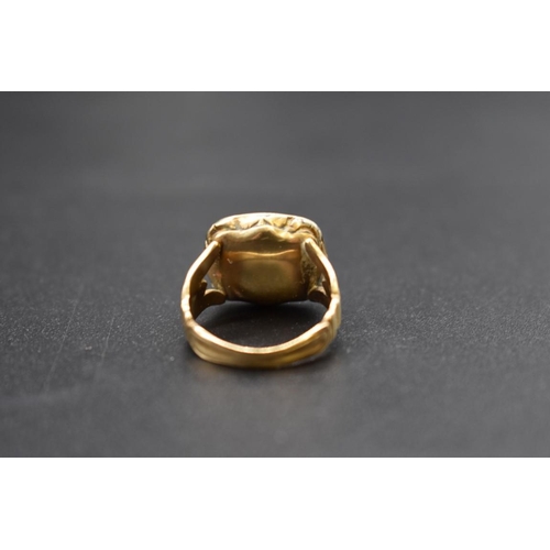 90 - An antique yellow metal ring, set intaglio carved bloodstone of a stag, size F 1/2.