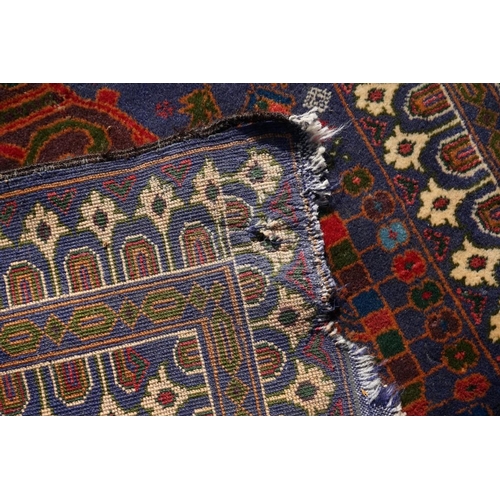 1105a - A Persian rug,&nbsp;central field decorated with two urns and flowers, 200 x 113cm.