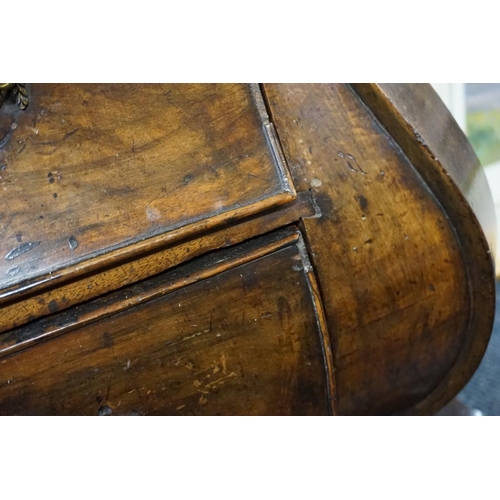 1396 - From Arundel Castle: an 18th century Dutch walnut bombe commode, with shaped top above four gra... 