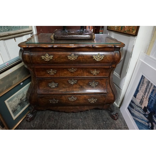 1396 - From Arundel Castle: an 18th century Dutch walnut bombe commode, with shaped top above four gra... 