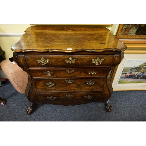 1396 - From Arundel Castle: an 18th century Dutch walnut bombe commode, with shaped top above four gra... 