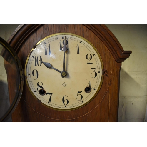 1215 - A 1930s mahogany Wellington clock, 43cm wide; together with another early 20th century mantel c... 