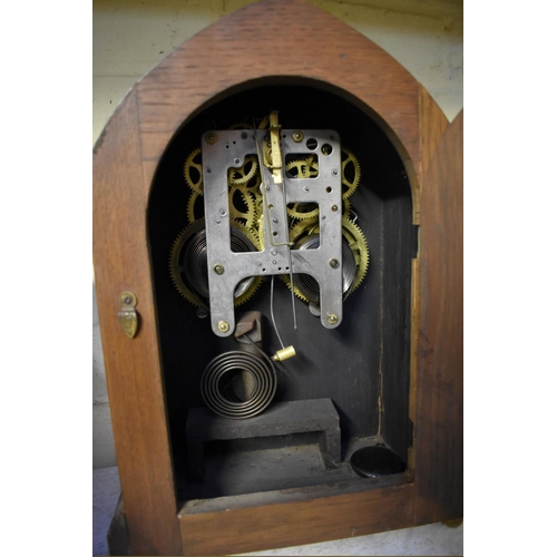 1215 - A 1930s mahogany Wellington clock, 43cm wide; together with another early 20th century mantel c... 