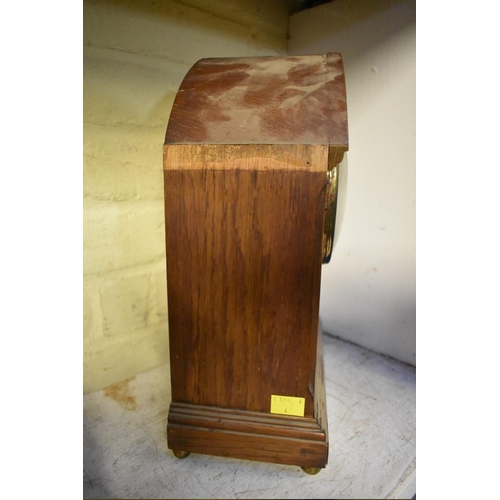 1215 - A 1930s mahogany Wellington clock, 43cm wide; together with another early 20th century mantel c... 