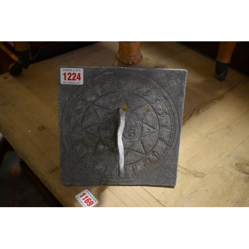 1224 - A small lead sundial, 18cm wide; together with three other items.