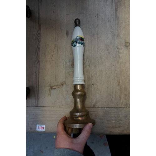 1238 - Six brass and pottery beer pump handle.