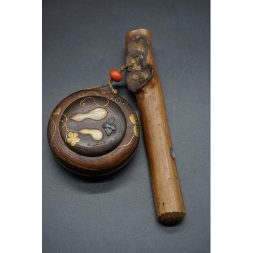 1294 - A Japanese wood kiseruzutsu and circular tonkotsu, 19th century, the tobacco box decorated with gilt... 