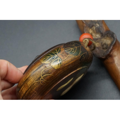 1294 - A Japanese wood kiseruzutsu and circular tonkotsu, 19th century, the tobacco box decorated with gilt... 