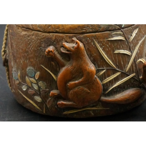 1295 - A good Japanese wood and inlaid tonkotsu, Edo, signed, 9cm wide; with attached monkey netsuke, signe... 