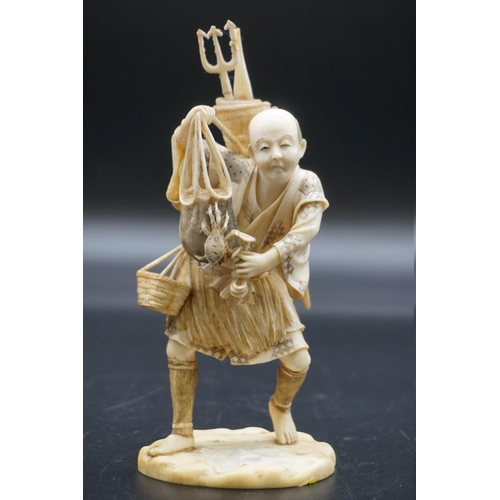 1296 - A Japanese carved ivory okimono, Meiji, depicting a crab fisherman, signed, 16.5cm high, (s.d.).... 