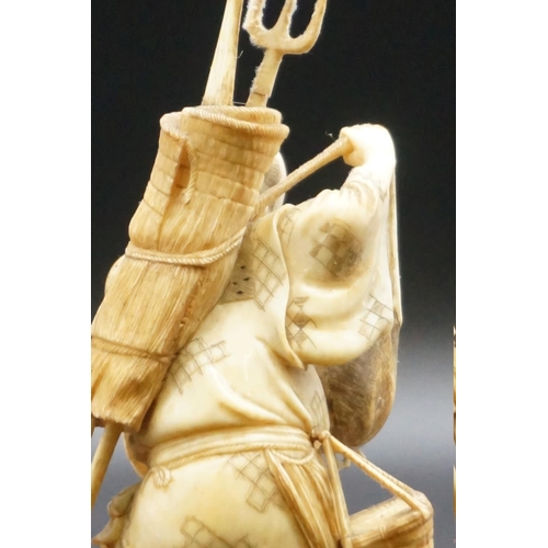 1296 - A Japanese carved ivory okimono, Meiji, depicting a crab fisherman, signed, 16.5cm high, (s.d.).... 